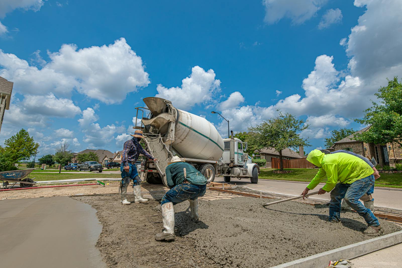 Concrete crew working on a residential driveway