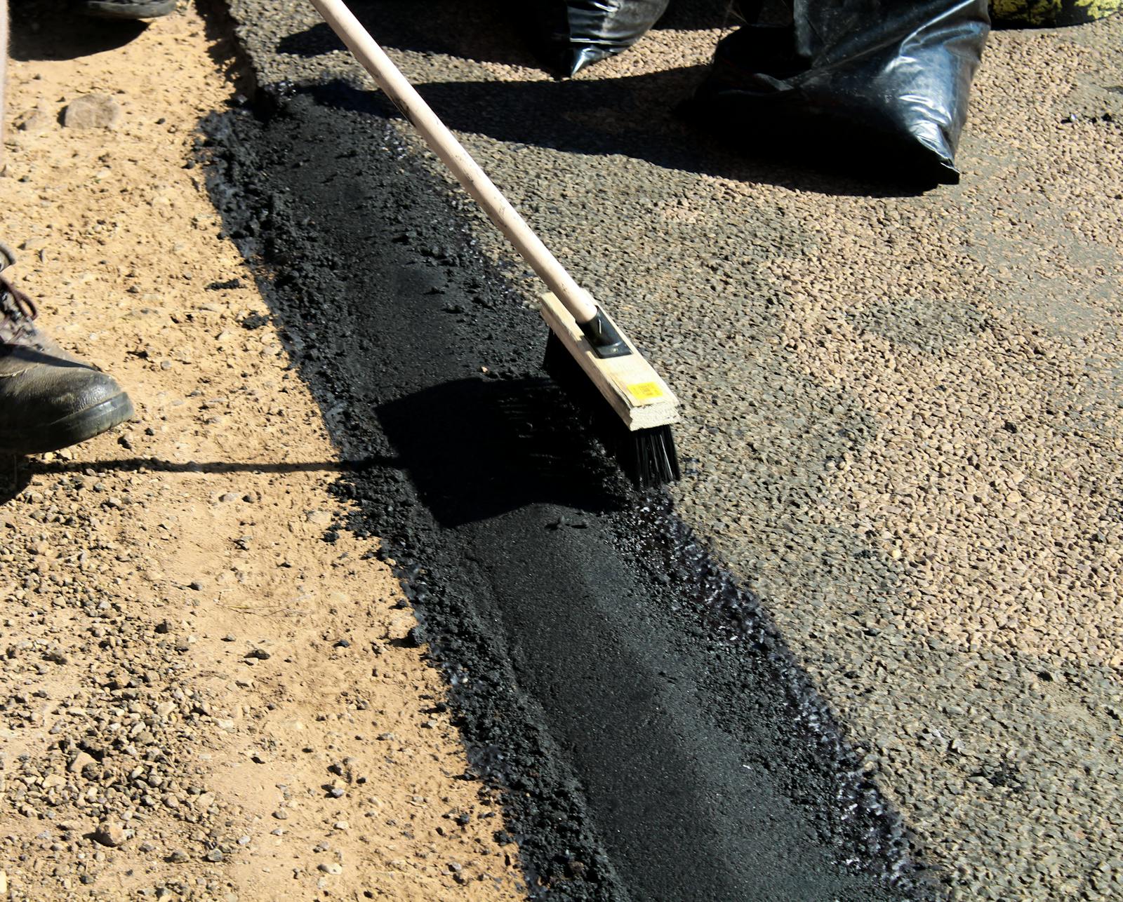 Close-up of surface repair work on pavement